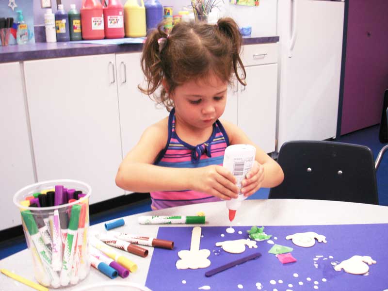 This little girl loves our art classes for kids in Katy - Romp n' Roll Katy.