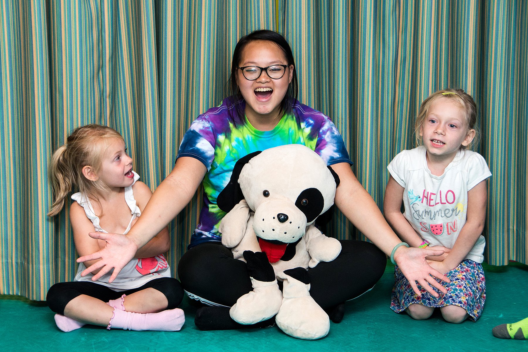 A parent and child smiling at a rompy birthday party, contact us today for rompy's adventure.