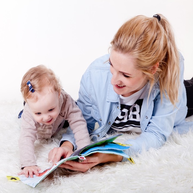 Young child playing by herself in her home - looking for tips on effective communication with you kids? Romp n' Roll in Pittsburgh, PA can help!