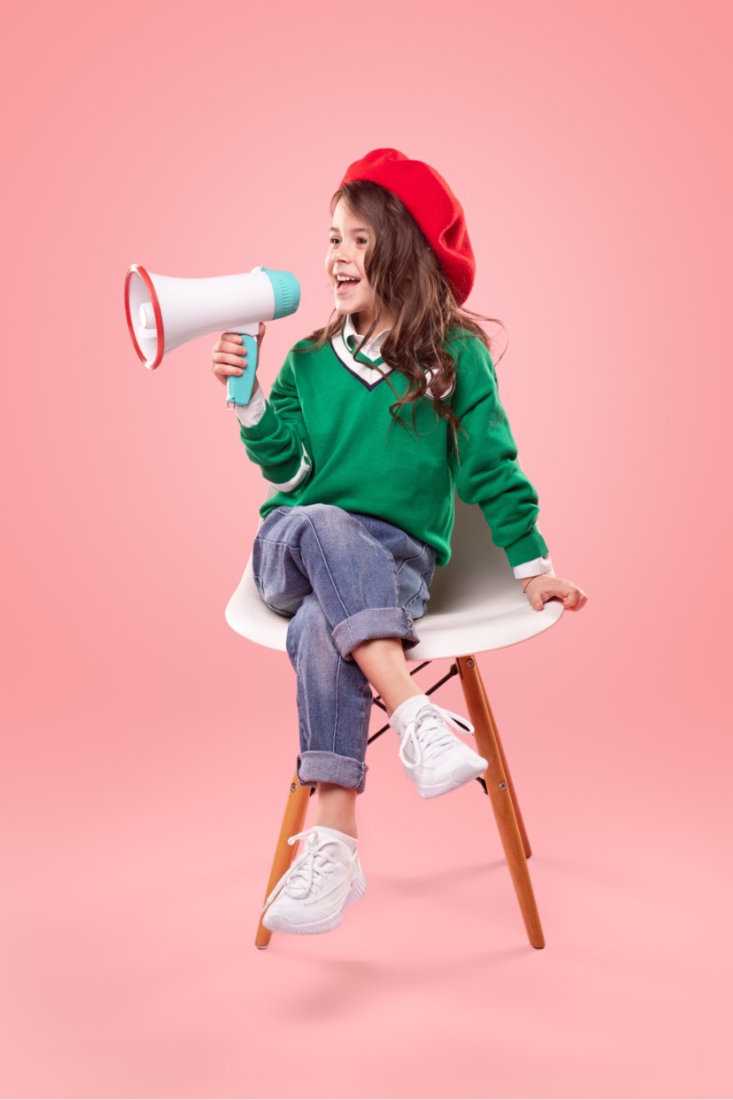 This girl in a movie director's chair has big goals - Romp n' Roll in Raleigh, NC has tips to help your kids dream and achieve big!