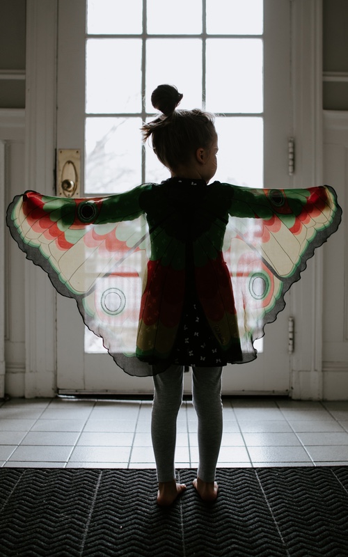 Young child playing by herself in her home - contact Romp n' Roll Midlothian for tips about coping skills.