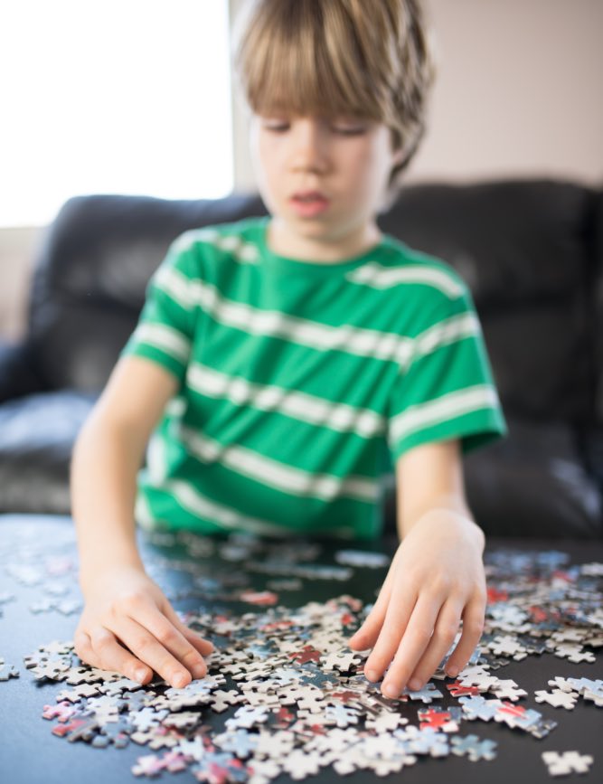 This boy enjoys a jigsaw puzzle on a chilly day thanks to recommendations from Romp n' Roll in Wethersfield, CT.