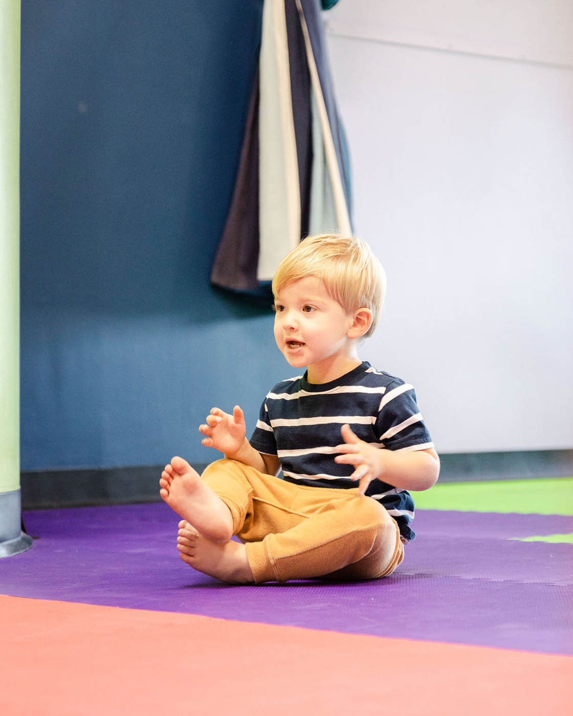 A boy at Romp n' Roll enjoying the sensory gym.