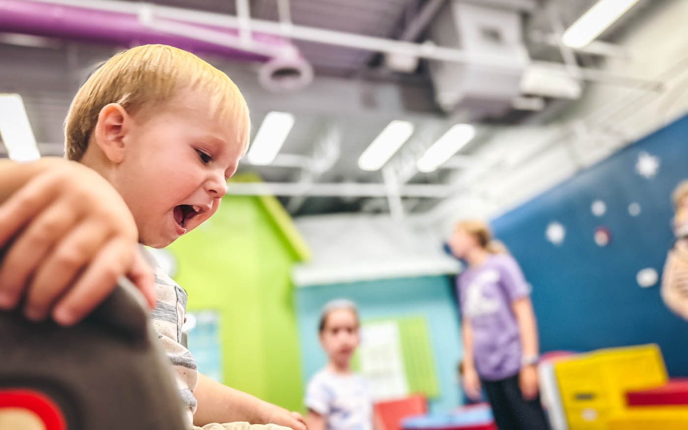 Toddlers playing at Romp n' Roll's classes for 1 year olds.