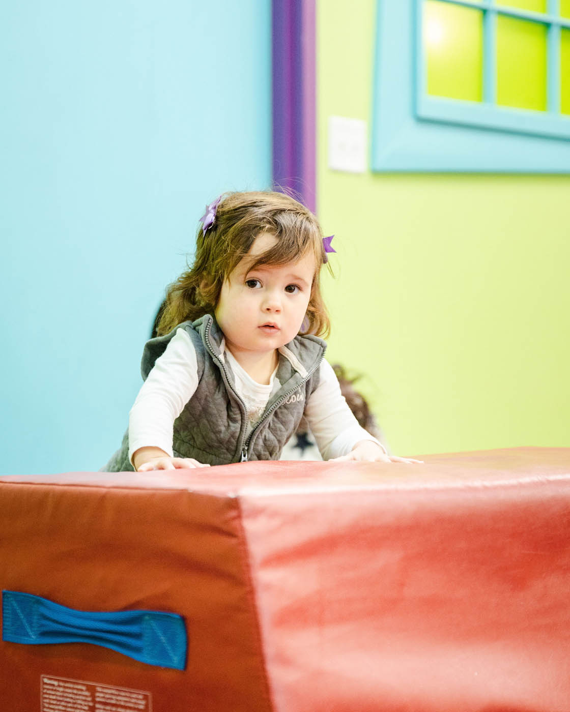 A little baby girl playing on Romp n' Roll equipment, Romp n' Roll is your top fun places.