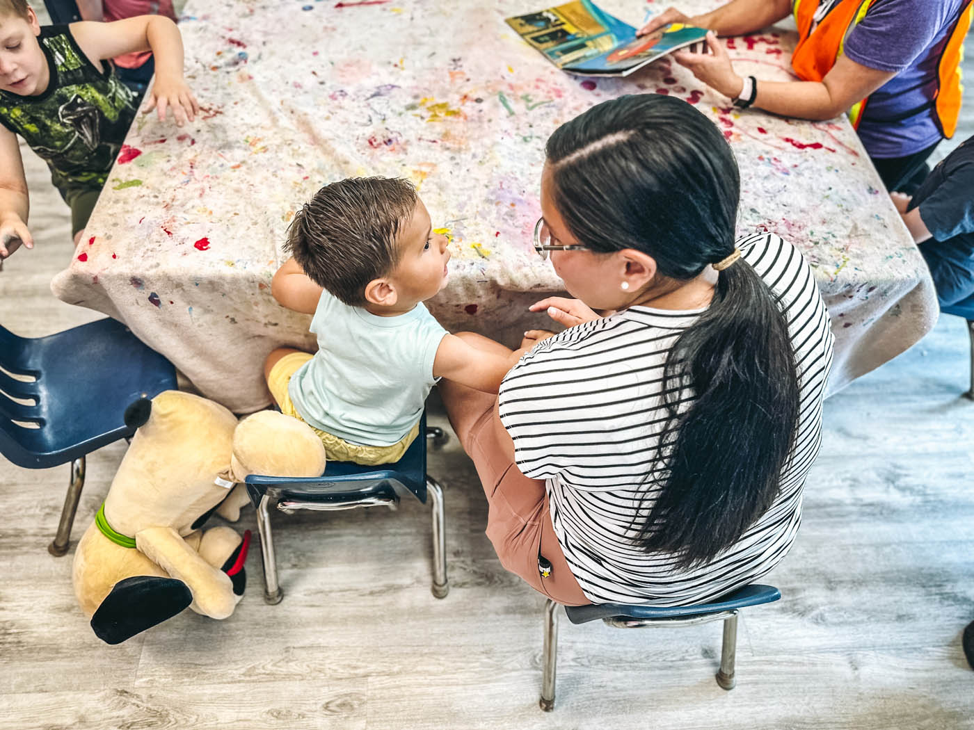 An art class with kids and adults at Romp n' Roll.