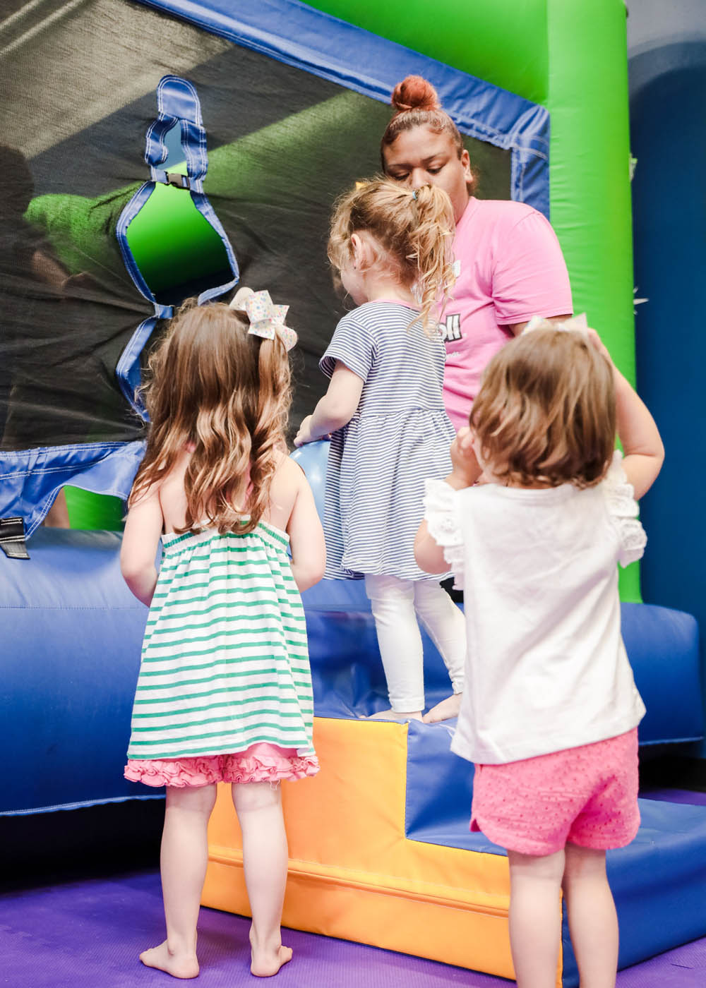 A group of kids going in to adventure our kid-safe equipment at Romp n' Roll.