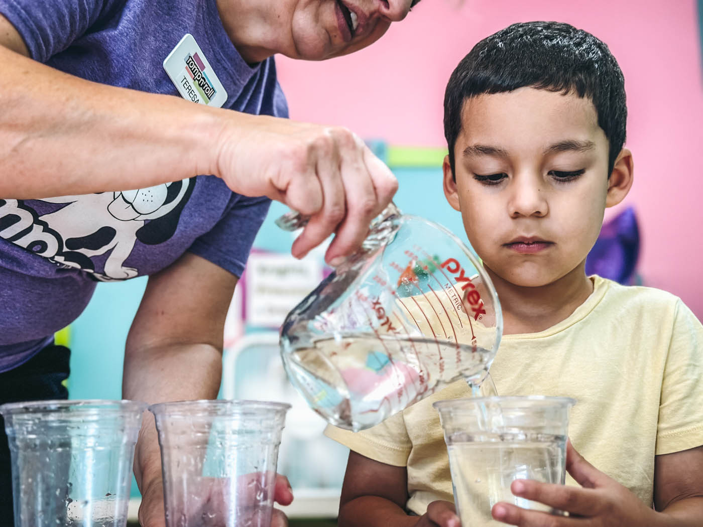 A young boy enjoying Romp n' Roll's science classes, sign up for our toddler & baby classes.