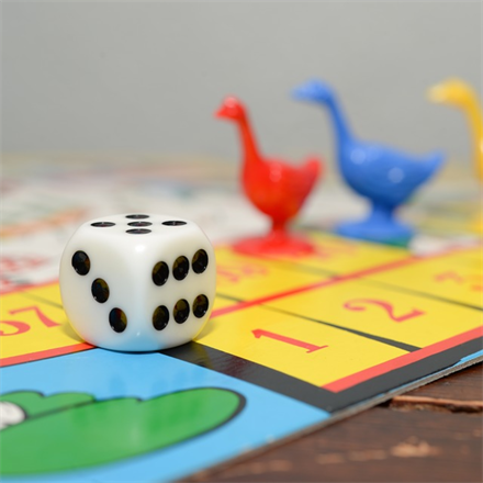 Playing board games is a great way to help young kids retain basic math skills - contact Romp n' Roll in Katy, TX for summer classes.