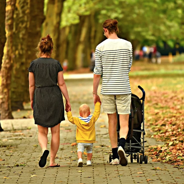 This family is taking a walk in the fall weather - learn more tips to stay active with your kids with Romp n' Roll in St. Petersburg, FL.